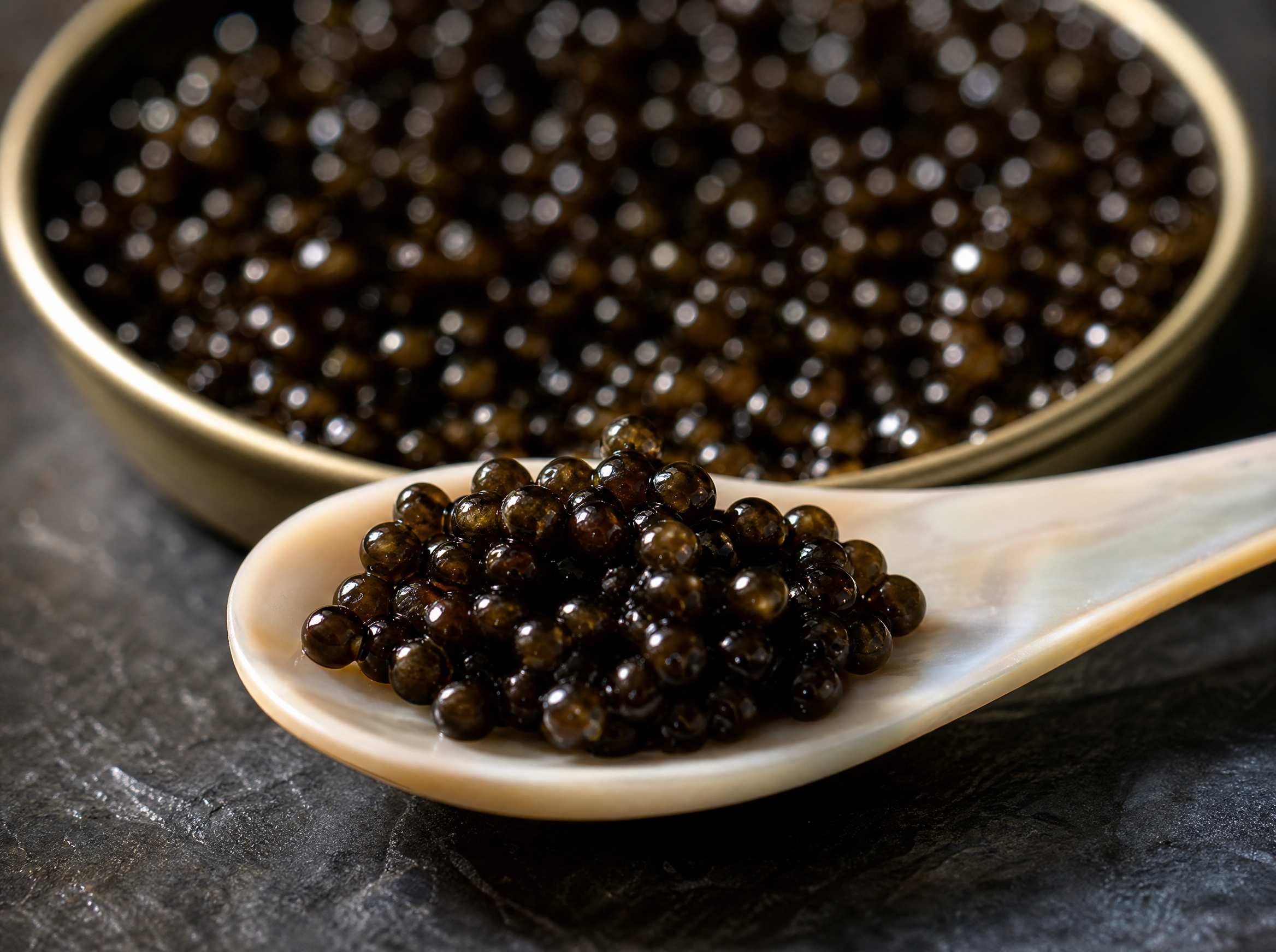Ossetra caviar pearls close-up macro on mother-of-pearl spoon
