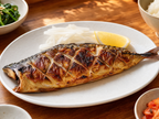 Korean semi-dried grilled mackerel godeungeo-gui on white ceramic plate with daikon and lemon, bright wooden table home dining